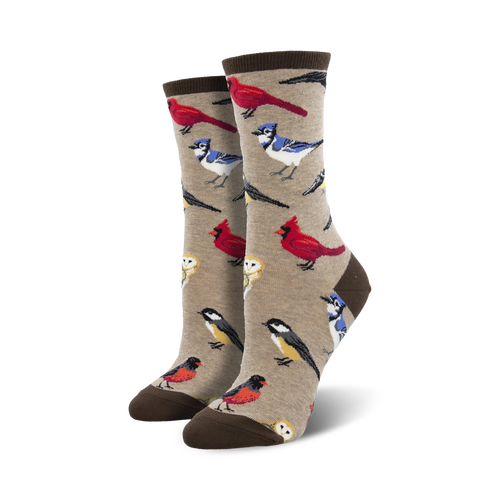 Pair of crew socks featuring a beige background with various colorful birds.  Red cardinals, blue jays, and other songbirds are depicted.