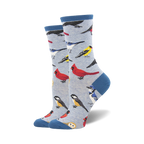 Lifestyle shot showing the socks on a person's feet, showcasing the light blue version of the bird socks.