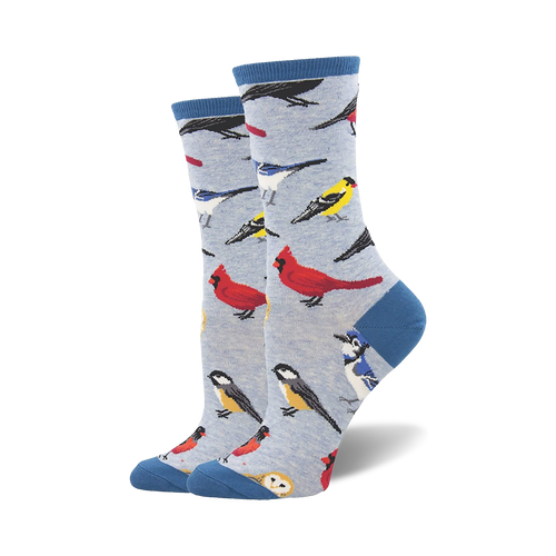 Lifestyle shot showing the socks on a person's feet, showcasing the light blue version of the bird socks.