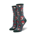Pair of crew socks with a whimsical mushroom pattern. The socks are teal and feature red and white mushrooms.