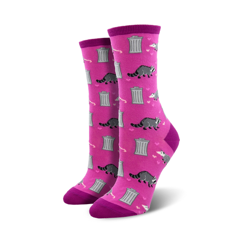 Pair of women's crew socks. Pink background with gray raccoons, hearts, and dumpsters. 