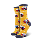 Pair of crew socks in yellow and navy blue featuring a repeating pattern of vintage camper vans and the phrase 'Enjoy the Ride'.