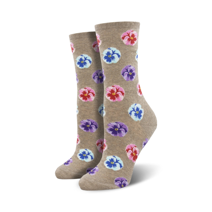  women's crew socks with a colorful pansy flower pattern on a light brown background.  