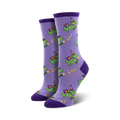 Lifestyle product shot of Freaky Frogs socks on a model's feet. The socks are the purple variant.