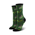 Pair of women's crew socks in green and purple; whimsical design of frogs wearing wizard hats and holding wands, accented with yellow stars.