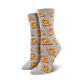 Close-up view of a pair of grey crew socks with a repeating pattern of illustrated slices of buttered toast.