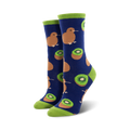 A pair of women's crew socks in navy blue, lime green, brown, and green.  The socks feature a whimsical pattern of kiwis and kiwi fruit slices.