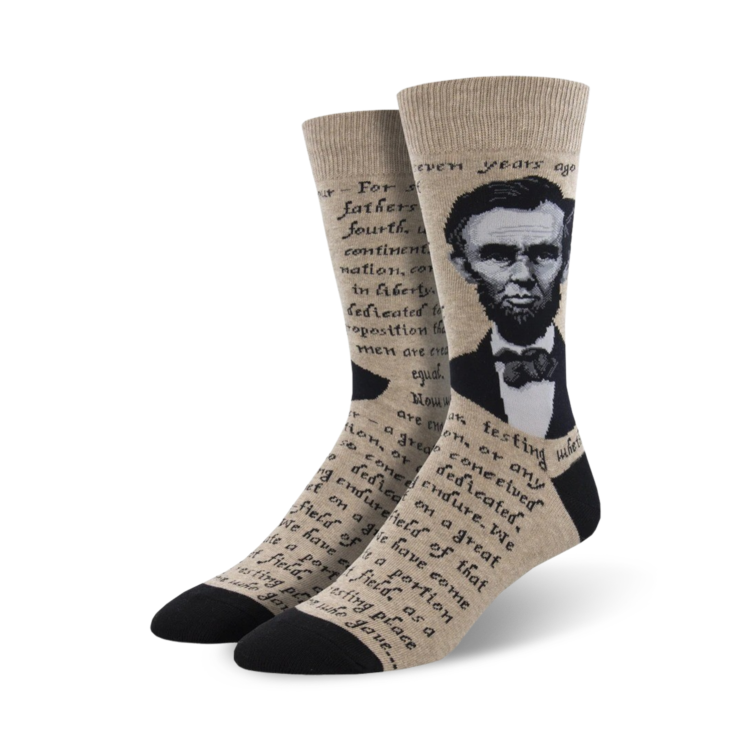 Crew socks in beige and black, featuring a portrait of Abraham Lincoln and text from the Gettysburg Address.