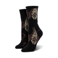 Pair of black crew socks with a repeating pattern of upside-down brown and beige bats. 