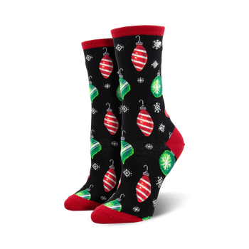 black crew socks with red and green ornament pattern, snowflakes, and red cuff and green toe.  