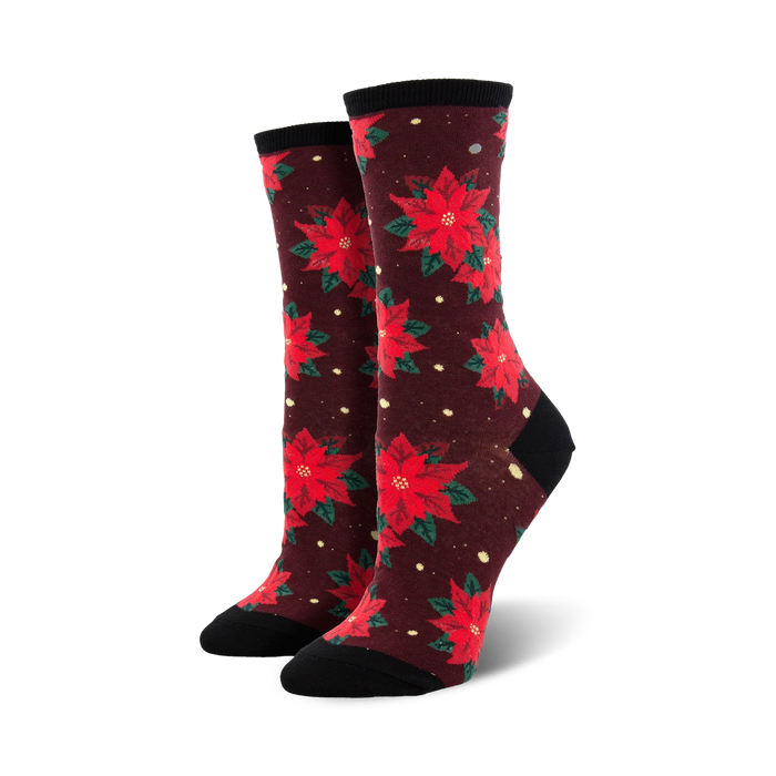 dark red crew socks with a pattern of red and green poinsettias with yellow centers.   