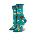 Pair of teal crew socks with a Thanksgiving-themed pattern: roasted turkeys, pumpkins, pie, and fall foliage.