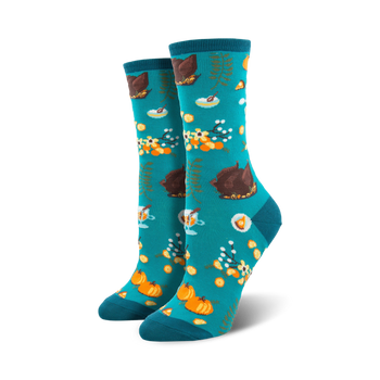 women's crew socks with turkey, pumpkin, pie, and flower patterns on blue background for a fun thanksgiving look. 