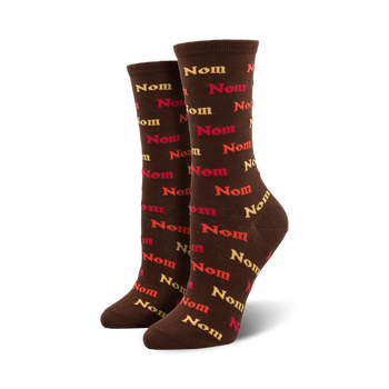  women's brown crew socks with colorful "nomnom nom" pattern, perfect for thanksgiving enthusiasts.   