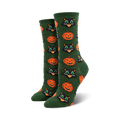 Pair of women's crew socks. Dark green background with repeating pattern of orange pumpkins and black cat faces.