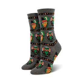 gray owl-patterned crew socks with green hats, moons and stars. womens halloween style.  