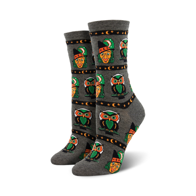 gray owl-patterned crew socks with green hats, moons and stars. womens halloween style.  