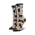 A pair of women's crew socks.  Grey background with black cats and orange pumpkins.  Halloween-themed.