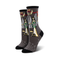 Gray crew socks with Catrina skeleton brides, skeletal cats, and a spiderweb pattern at the bottom.  Red, green, and yellow accents.
