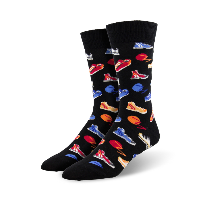 black crew socks with fun pattern of colorful sneakers, basketballs, and tennis balls.     }}