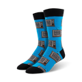 A pair of men's crew socks in bright blue, adorned with a pattern of retro brown and grey televisions.  Black cuffs add a stylish contrast.