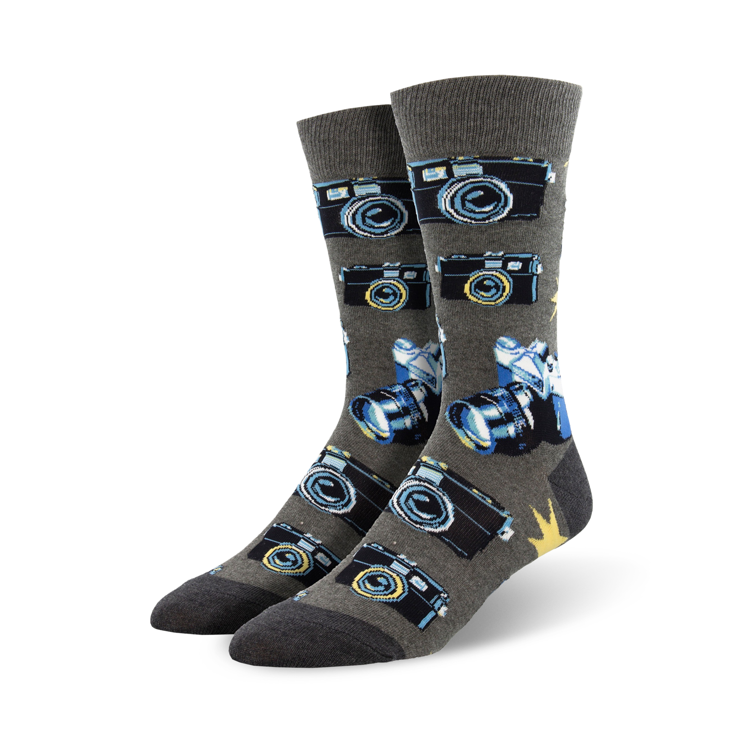 A pair of grey crew socks with a pattern of vintage cameras and lenses in blue and black. 