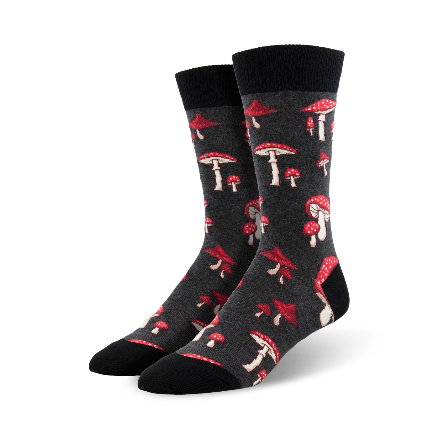 A pair of dark grey crew socks adorned with a scattered pattern of red and white mushrooms. Fun and quirky!