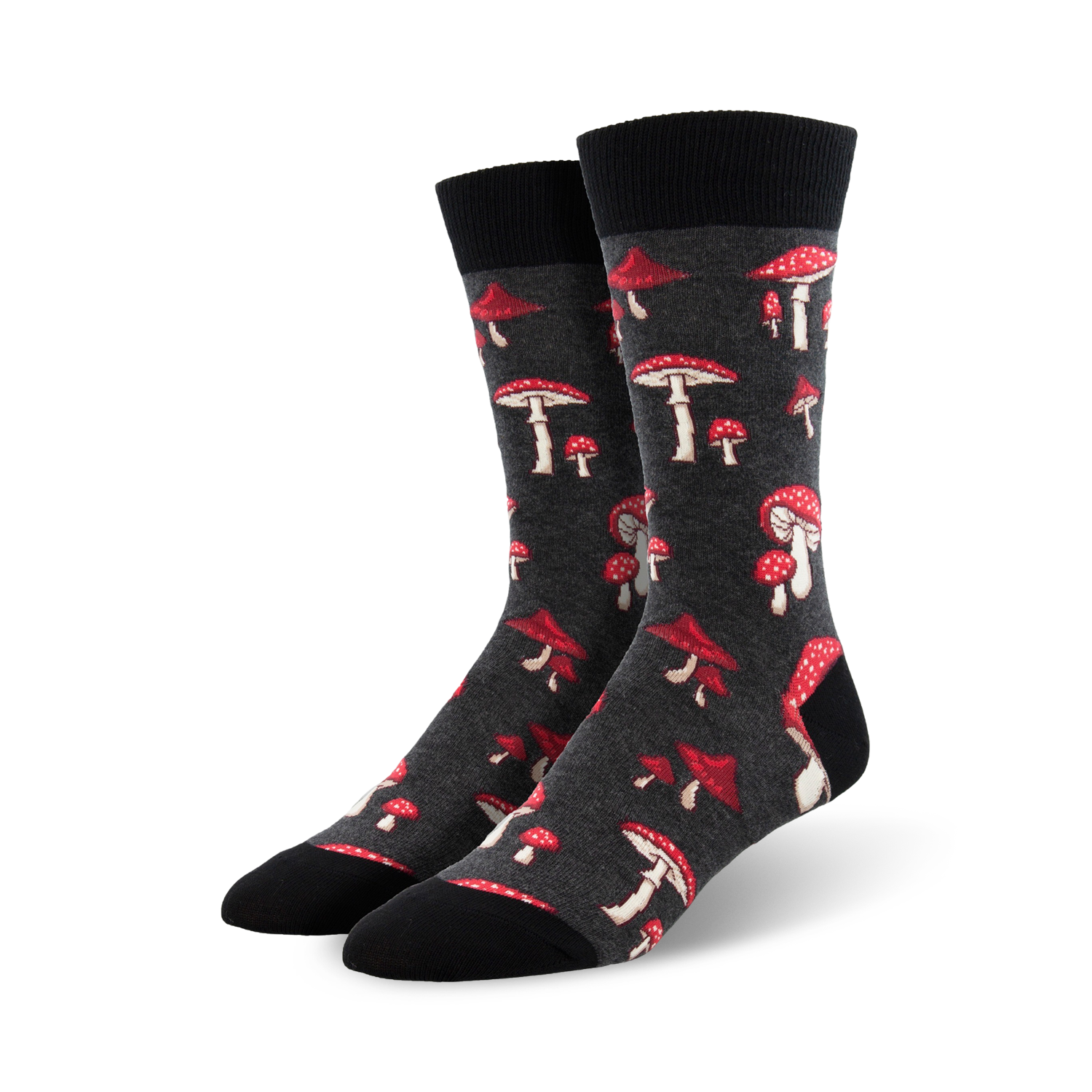 A pair of dark grey crew socks adorned with a scattered pattern of red and white mushrooms. Fun and quirky!