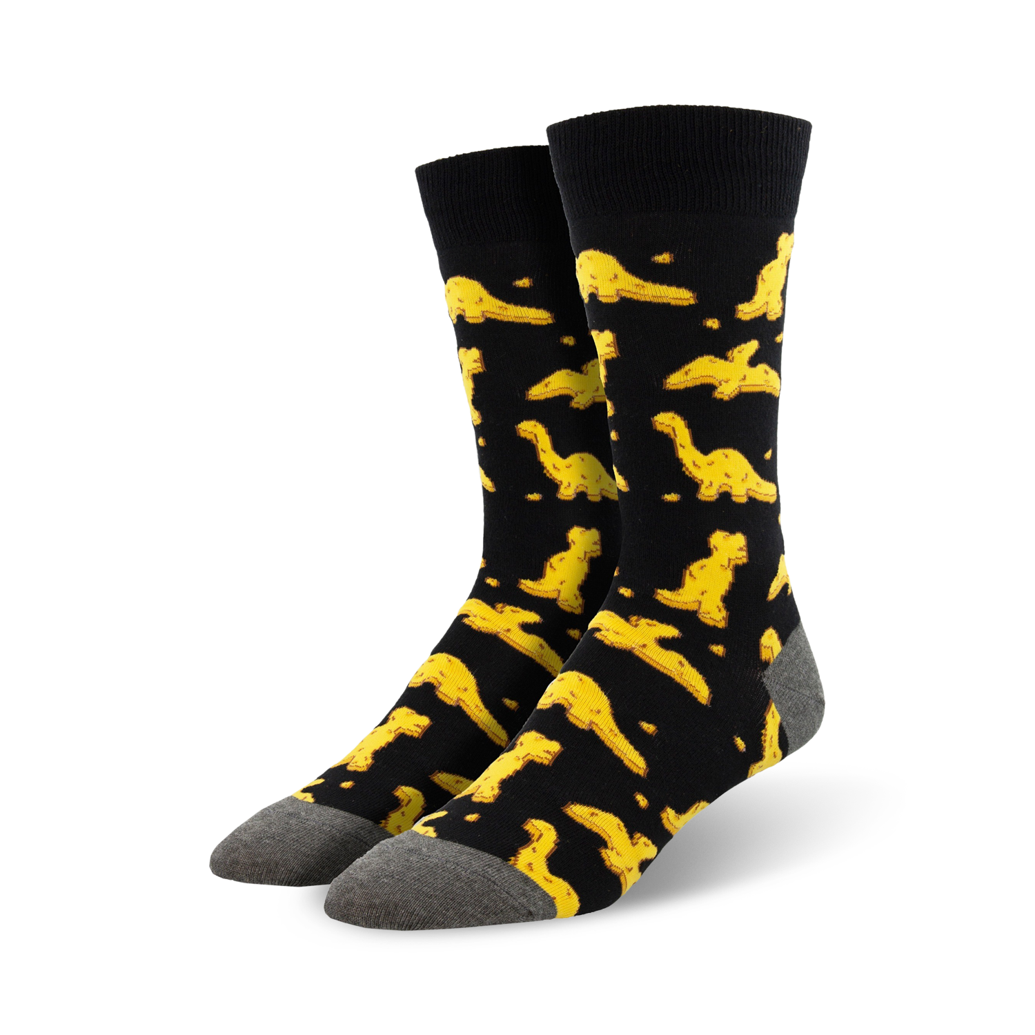 Pair of black crew socks with a fun pattern of yellow dinosaur nuggets.  Comfortable and playful!