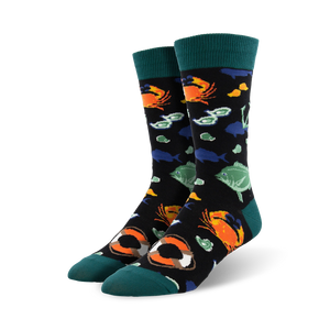 black crew socks with a pattern of sea creatures, buoys, and a life preserver.  