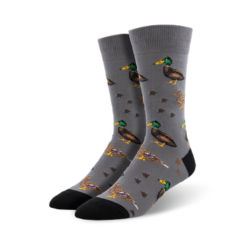 gray crew socks with a pattern of green-headed ducks in various poses and duck footprints.  