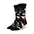 A pair of black crew socks with white geese, skulls, and the words "Honk!" and "Hiss!" in orange. 