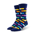 Pair of navy blue crew socks with multicolored pill-shaped designs.  The pills are orange, yellow, purple, teal, and white.