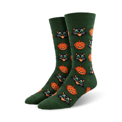 vintage halloween black cat and pumpkin crew socks: mens, crew length, green socks with a festive halloween pattern of black cats with green eyes and orange pumpkins with orange eyes.   