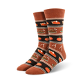 Close-up view of Thanksgiving Dinner socks in burnt orange colorway, showcasing the detailed pattern.