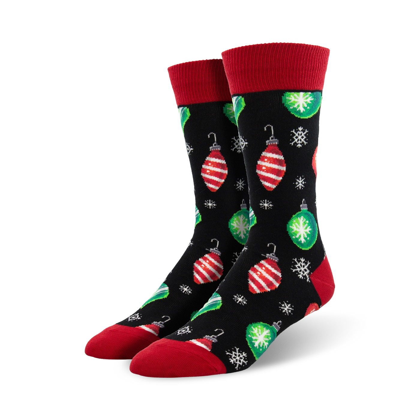 Pair of crew socks with a black background, red and green Christmas ornaments, and snowflakes. Red cuffs.