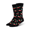 A pair of black crew socks with a pattern of red cars carrying Christmas trees and small green trees. Festive and fun!