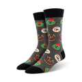 Crew socks in grey with a fun Christmas design. Features donuts decorated as wreaths, reindeer, and snowmen. Red, green, and white accents on a dark grey background.