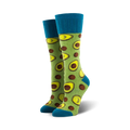 Pair of lime green crew socks featuring avocado slices and brown dots. Teal blue cuffs.