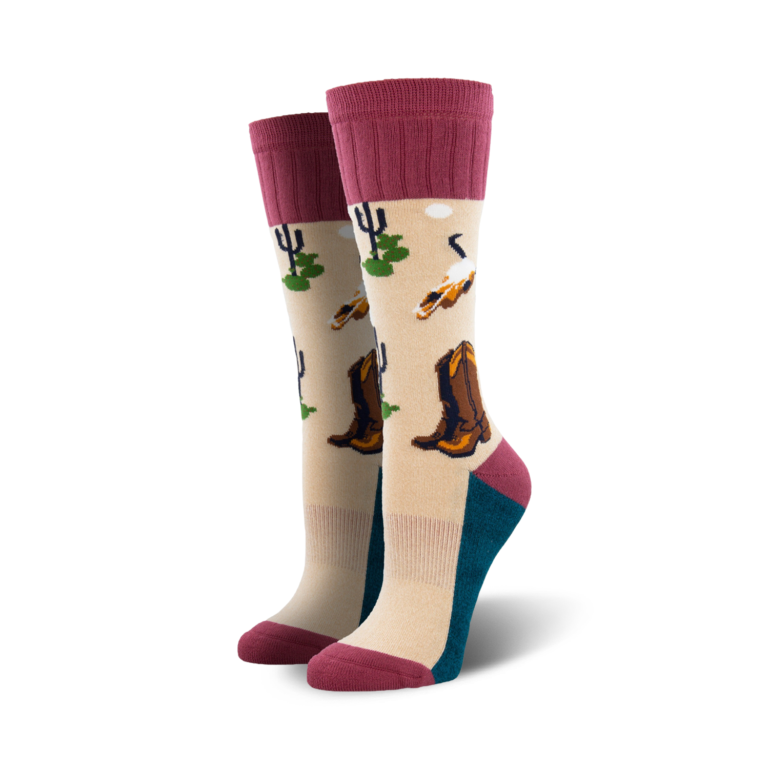 A pair of beige crew socks with maroon cuffs. The socks feature a desert landscape design with cowboy boots, cacti, and birds.