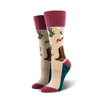 beige boot socks with pink ribbed cuff feature pattern of cowboy boots, cacti, and skulls.  