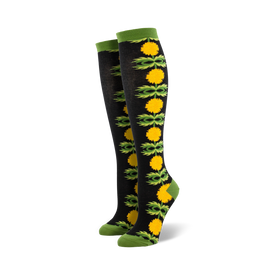 black knee high socks for women with yellow dandelions, green stems and leaves pattern.  