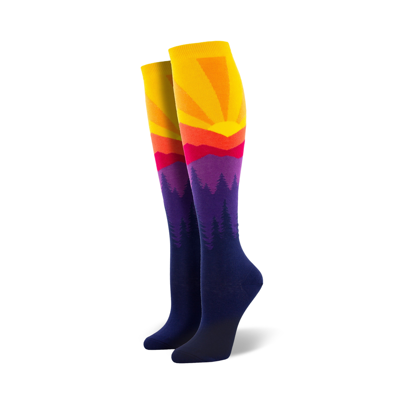 Pair of women's knee-high socks showcasing a vibrant sunset over silhouetted mountains. Colors include yellow, orange, red, purple, and navy blue.