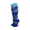 Pair of women's knee-high socks in blue and teal, adorned with a pattern of whales swimming underwater, accented with small birds near the top.