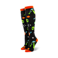 Pair of black knee-high socks with orange cuffs. Features green aliens, UFOs, planets, and stars.