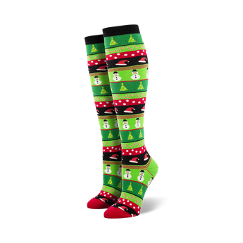 Pair of women's knee-high Christmas socks. Green, red, and black stripes with snowmen, Christmas trees, and candy cane designs.
