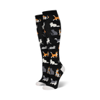 Pair of black knee-high socks with a pattern of cute cats in orange, grey, and white.  A fun and whimsical design.