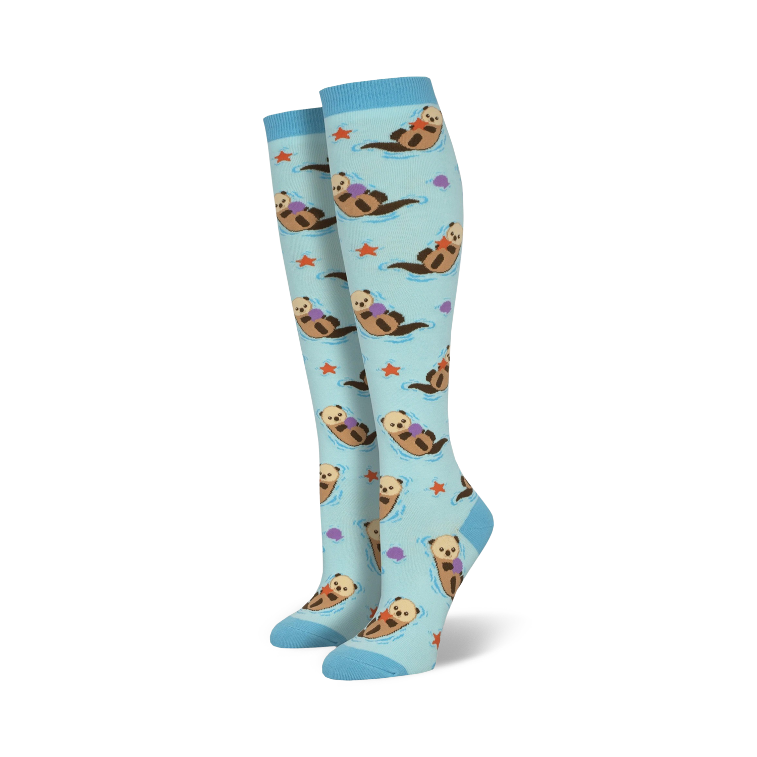 Pair of light blue knee-high socks featuring a repeating pattern of otters holding rocks, alongside starfish and seashells.