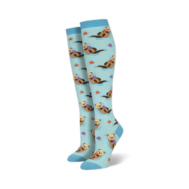 light blue women's knee-high socks, all over pattern of cartoon otters swimming in water, and holding purple starfish   