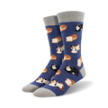 A pair of crew socks in blue with a pattern of cats and bread loaves. The cats are calico and black. The socks have gray cuffs.